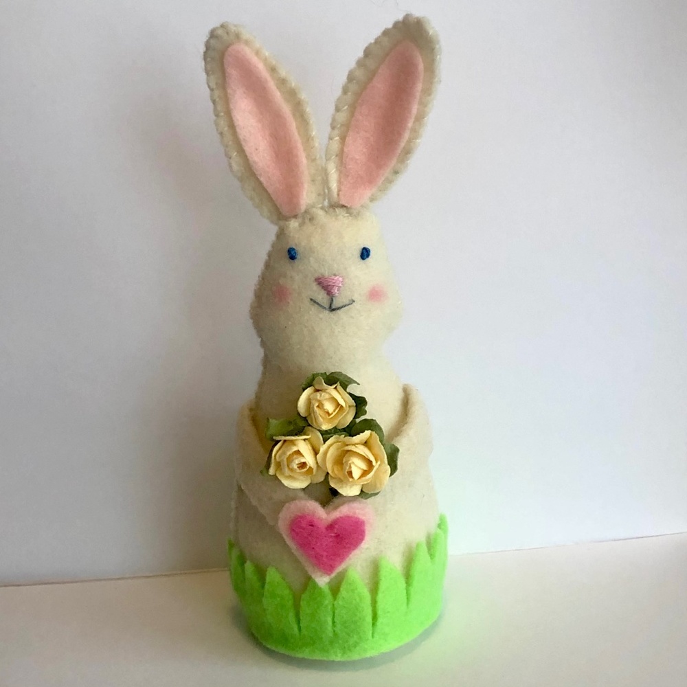 Bunny art doll holding yellow roses and. a heart